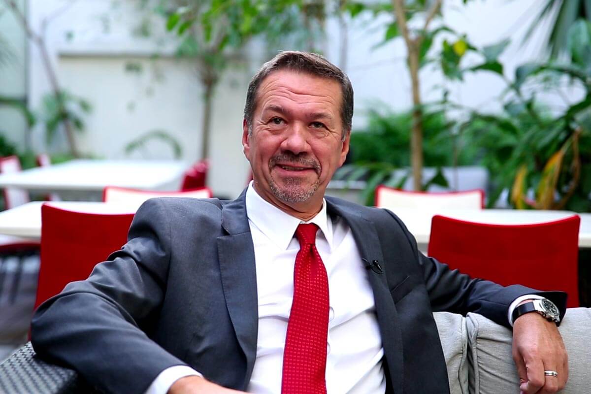 thierry hebraud in suits sitting in MCB P.louis